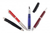FOUR ASSORTED PENS AND PENCILS