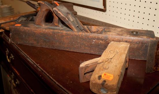 Four assorted wood planes and a