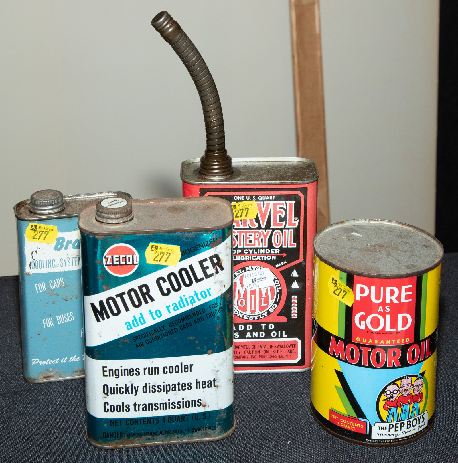 FOUR AUTOMOTIVE LITHOGRAPHED TINS