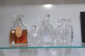 FOUR BACCARAT PERFUME BOTTLES.