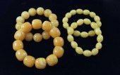 FOUR BALTIC AMBER BRACELETS, E