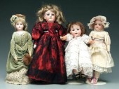 Four bisque head dolls: one wi