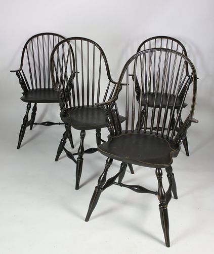 FOUR BLACK PAINTED CONTINUOUS ARM