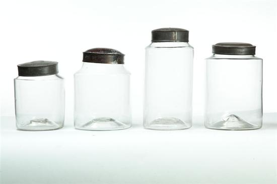 FOUR BLOWN GLASS CANISTERS. 