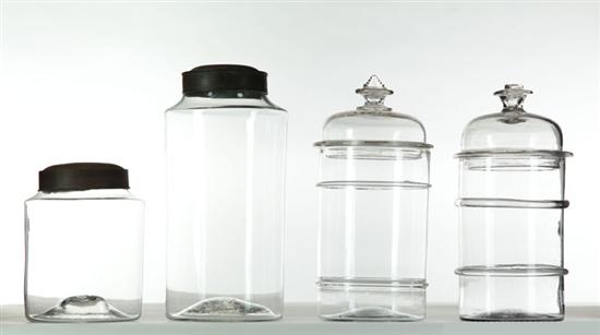 FOUR BLOWN GLASS CANISTERS. 