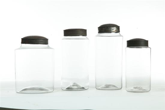 FOUR BLOWN GLASS  STORAGE JARS WITH