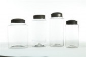 FOUR BLOWN GLASS  STORAGE JARS