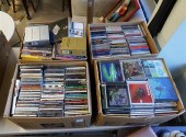 FOUR BOXES OF CDS AND DVDSFour