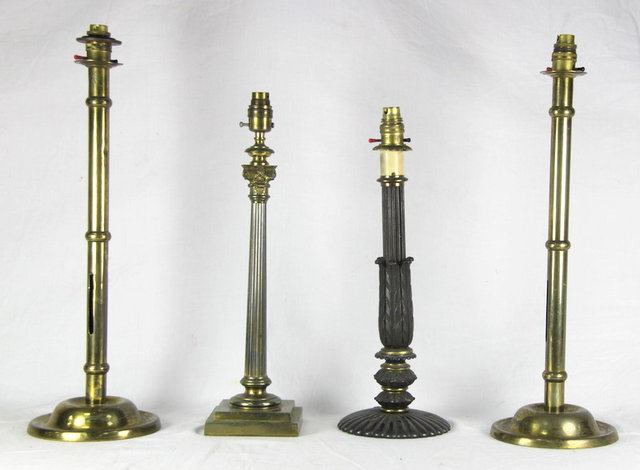 Four brass and bronzed table
