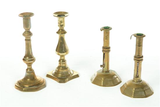 FOUR BRASS CANDLESTICKS. 
