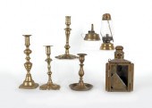 Four brass candlesticks togeth