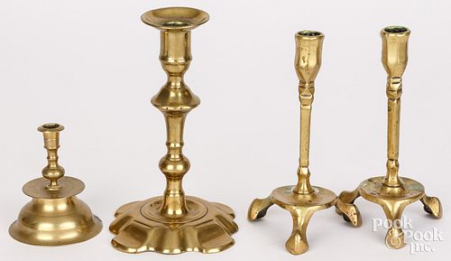 FOUR BRASS CANDLESTICKSFour brass