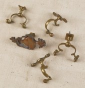Four brass jamb hooks together