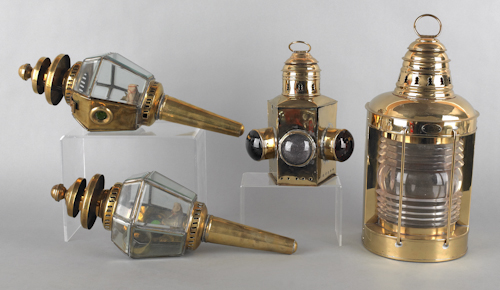 Four brass lanterns the largest