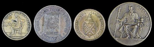 FOUR BRASS TOKENS.Four Brass