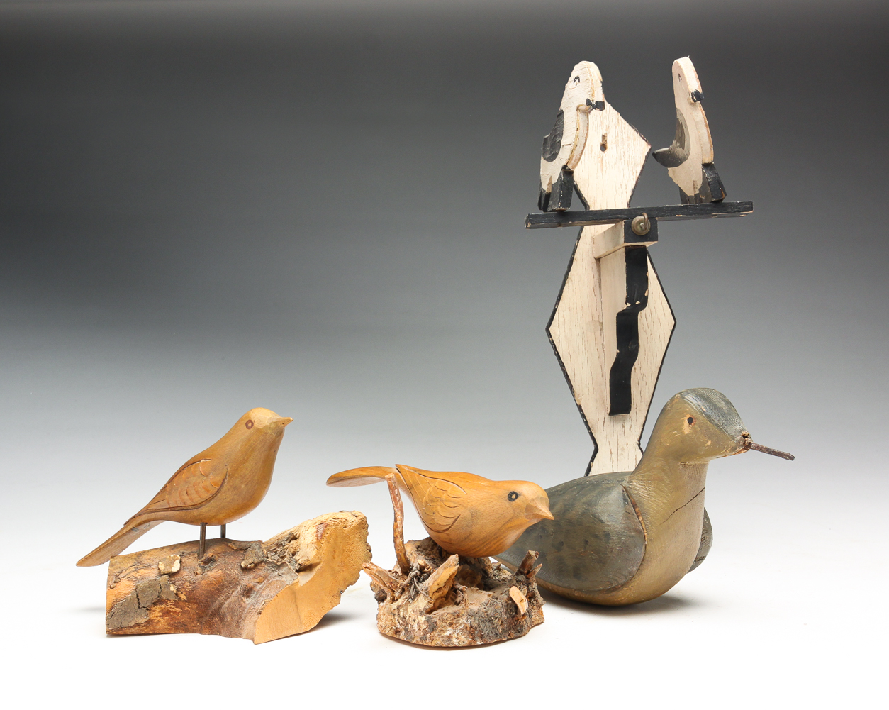 FOUR CARVED AMERICAN BIRDS.