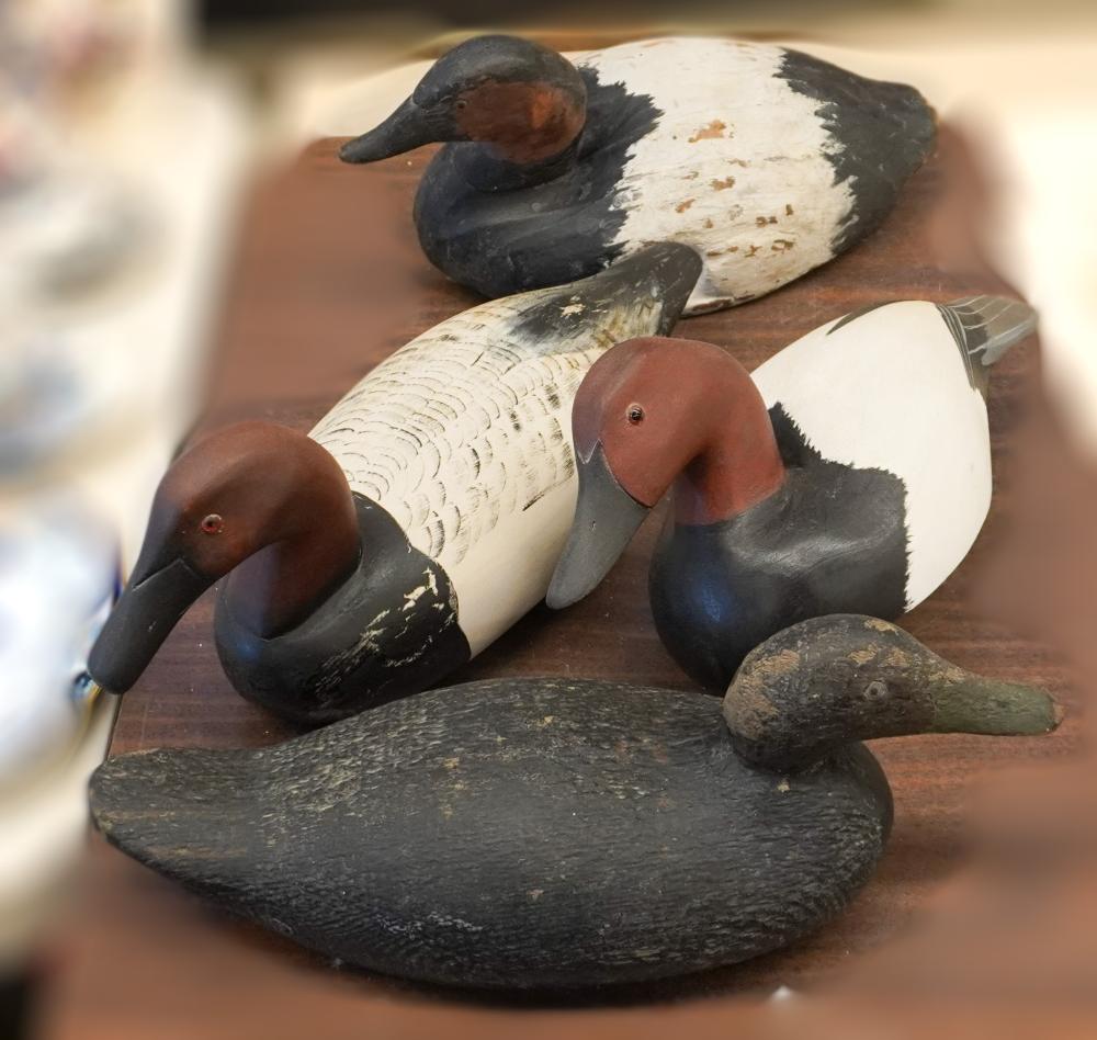 FOUR CARVED AND DECORATED WOOD DUCK
