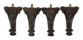 FOUR CARVED AND EBONIZED WOODE