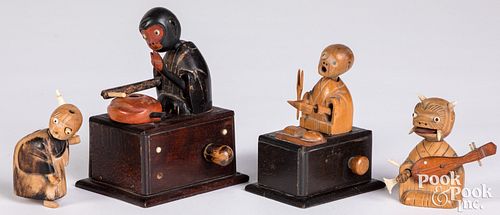 FOUR CARVED AND PAINTED WOOD KOBE