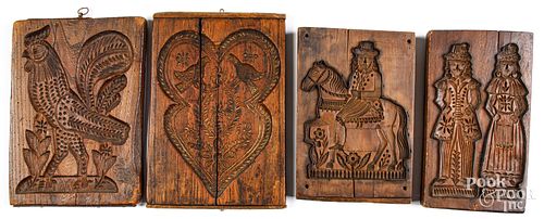 FOUR CARVED CAKEBOARDSFour carved