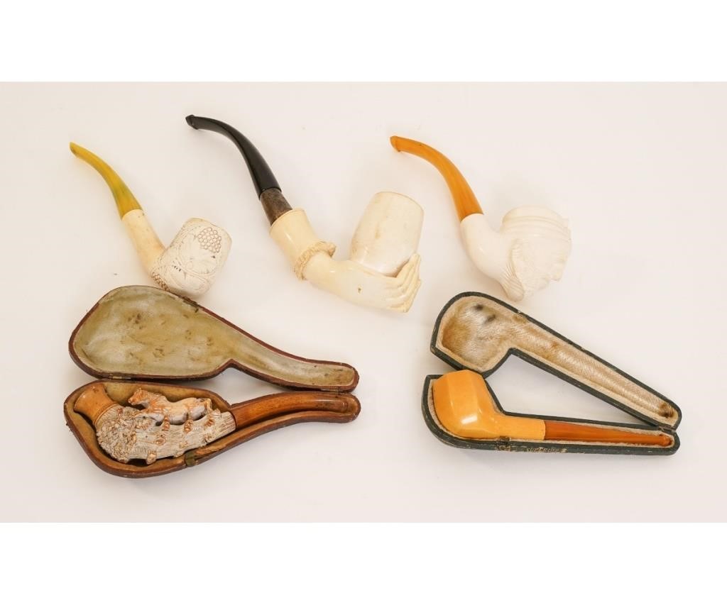 Four carved Meerschaum smoking