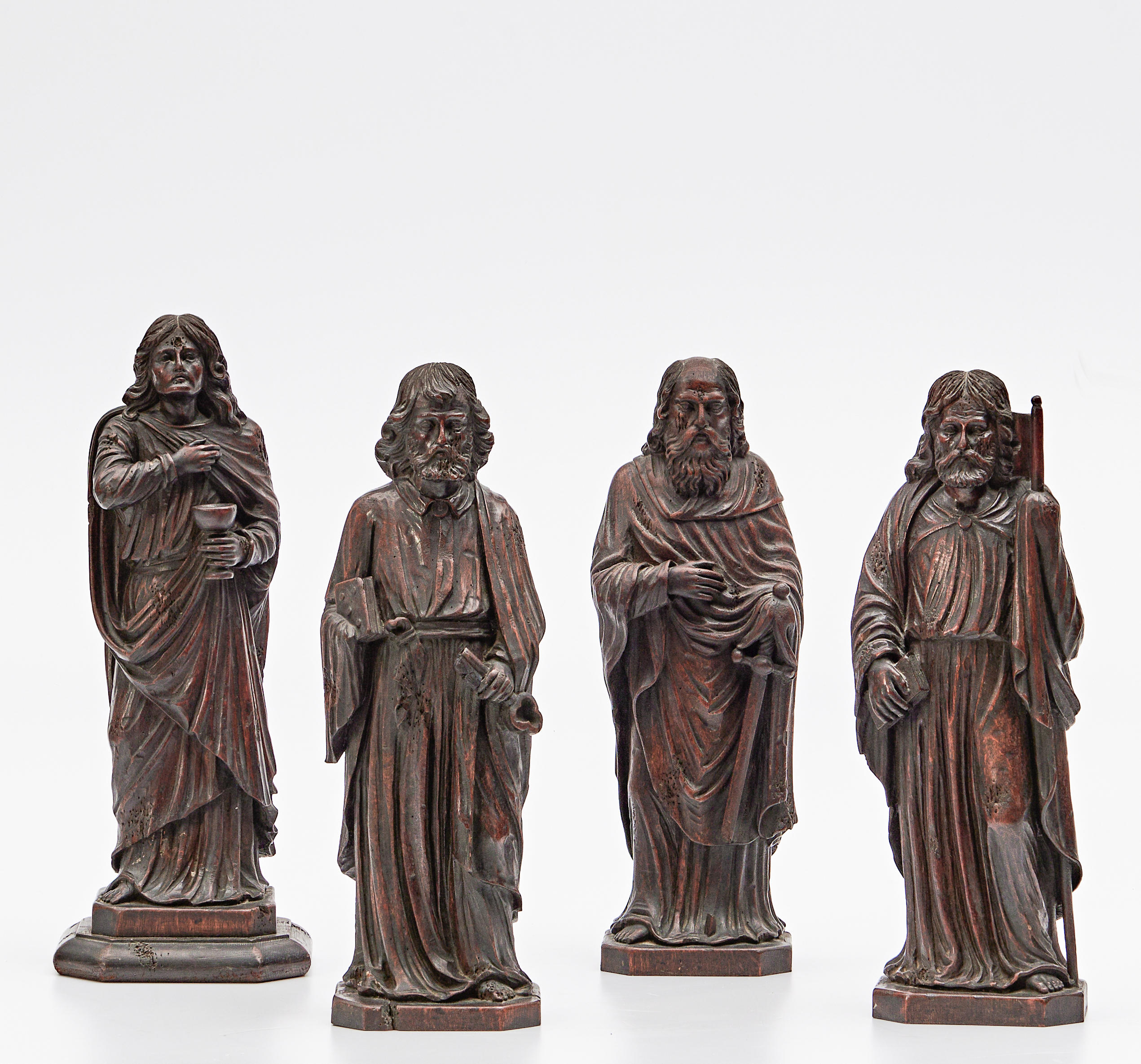 FOUR CARVED OAK APOSTLE FIGURES,