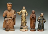 Four carved religious figures,