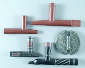 Four carved stone pipes: one r