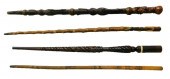 FOUR CARVED WALKING STICKS, LA