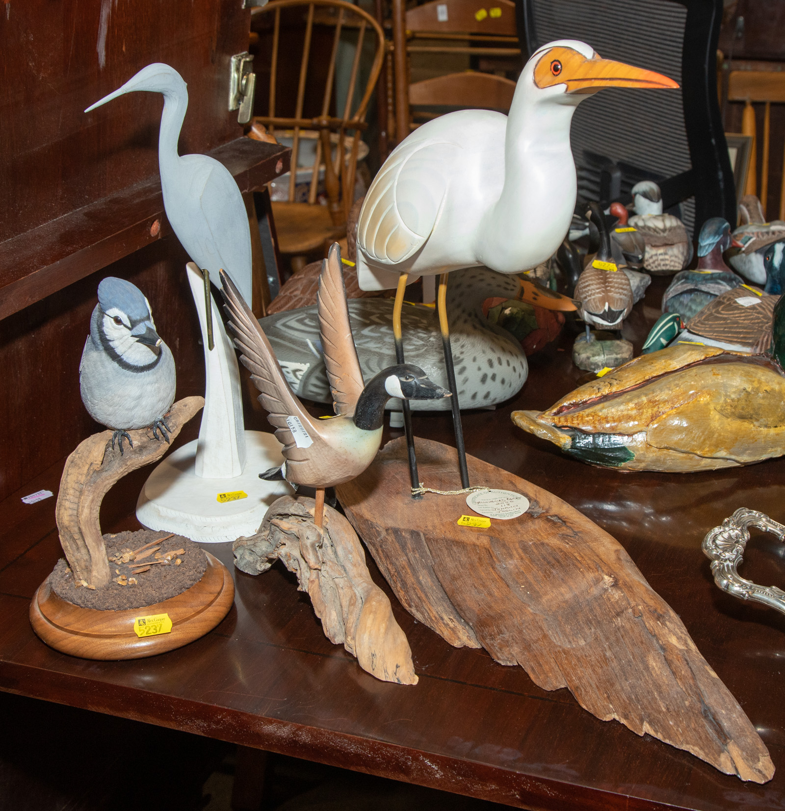 FOUR CARVED WOOD BIRDS Includes a