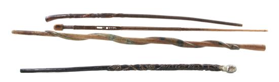 Four carved wood folk art canes