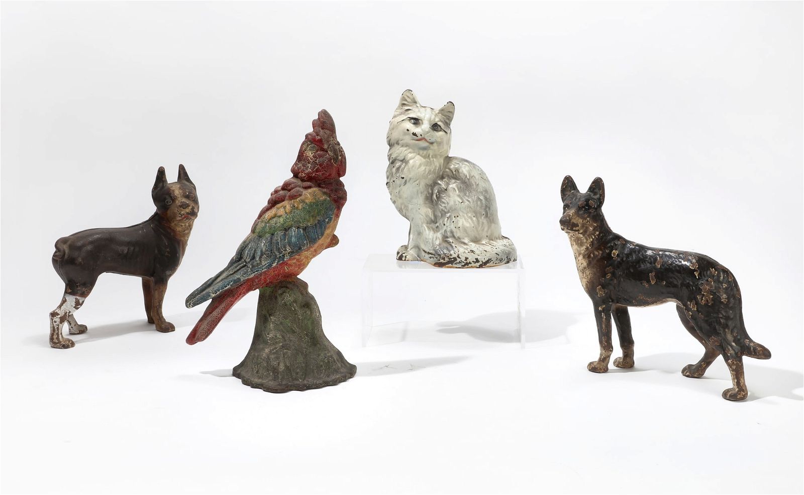 FOUR CAST IRON ANIMAL FORM