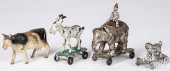 FOUR CAST IRON ANIMALS ON WHEE
