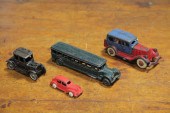 FOUR CAST IRON AUTOMOBILES.  A