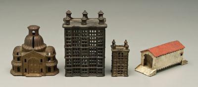 Four cast iron banks: skyscraper,
