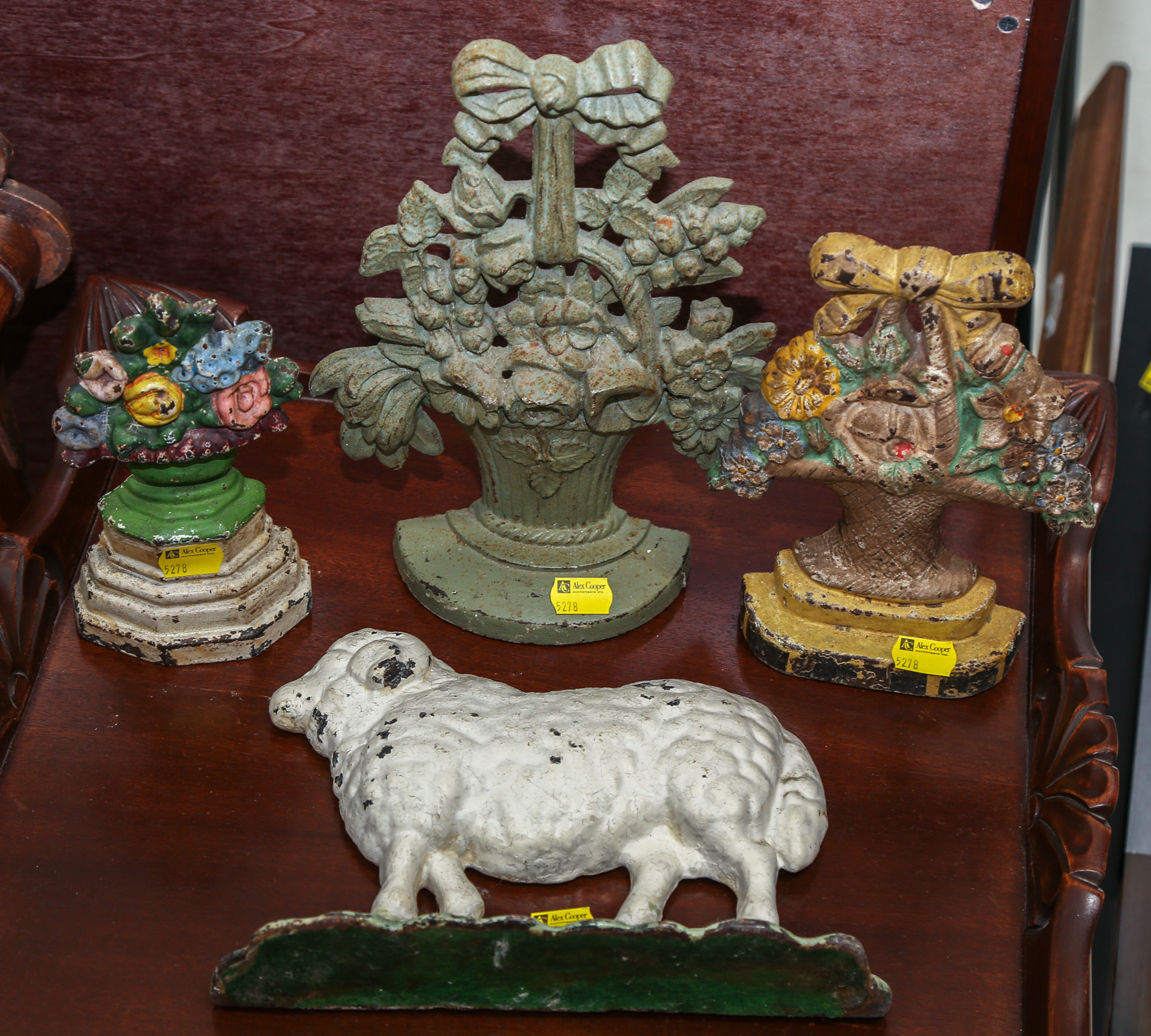 FOUR CAST IRON DOOR STOPS 7 1/4