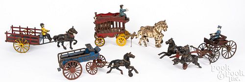 FOUR CAST IRON HORSE DRAWN