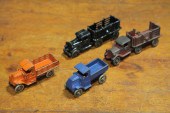 FOUR CAST IRON TRUCKS.  Americ