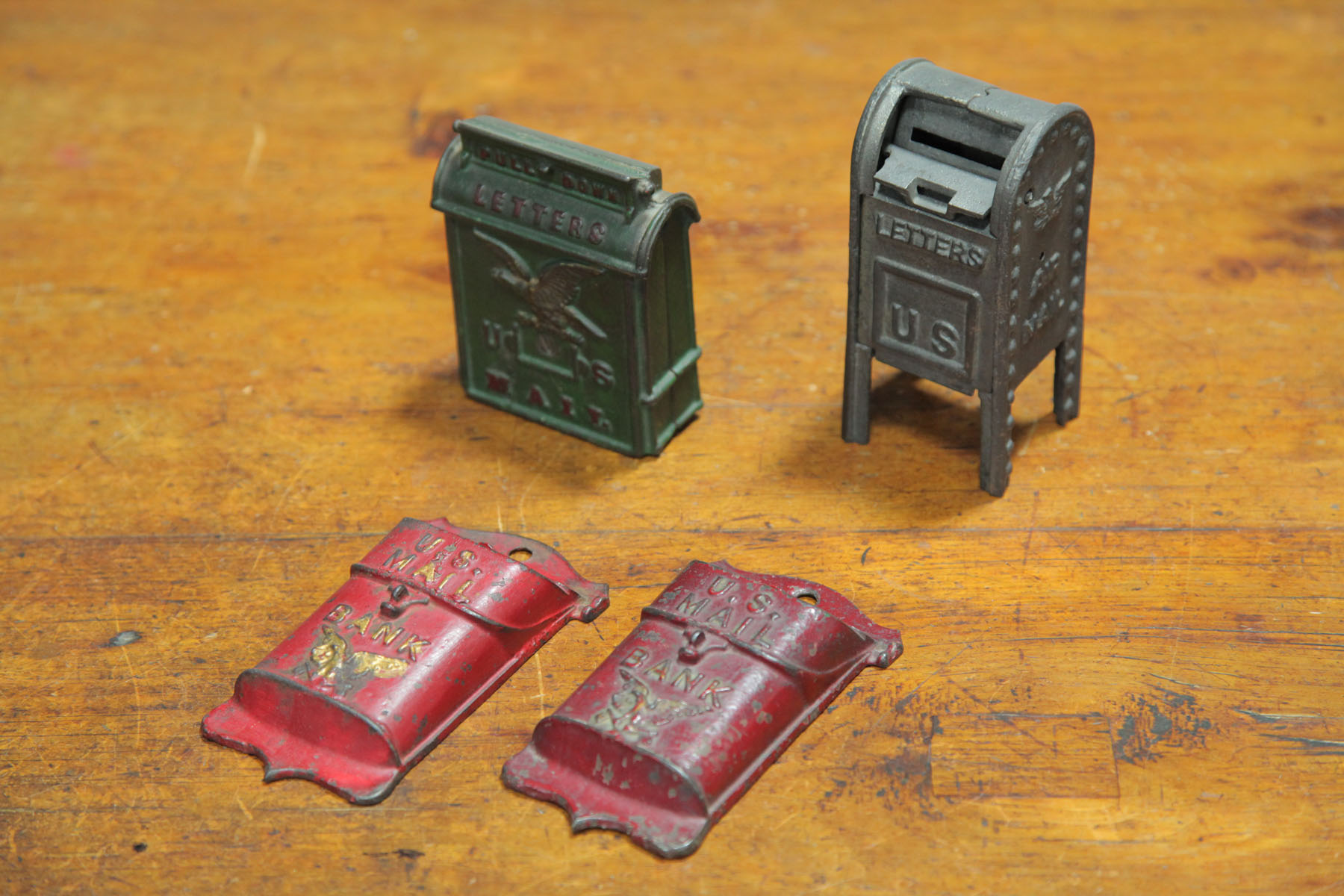 FOUR CAST IRON U.S. MAIL STILL
