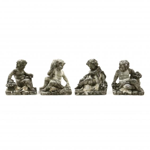 FOUR CAST STONE GARDEN STATUES OF