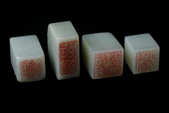 FOUR CELADON JADE SEALS. - Largest: