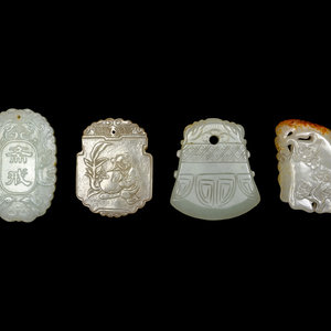 Four Chinese Celadon Carved Jade