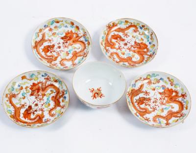 Four Chinese saucers decorated with