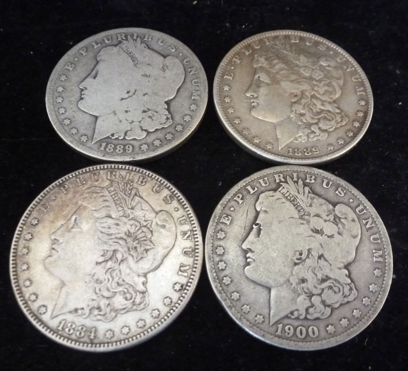 FOUR CIRCULATED MORGAN 90% SILVER