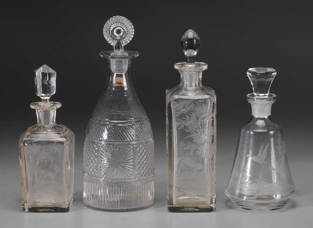 Four Clear Glass Decanters three