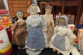 FOUR CLOTH DOLLS. Oil painted