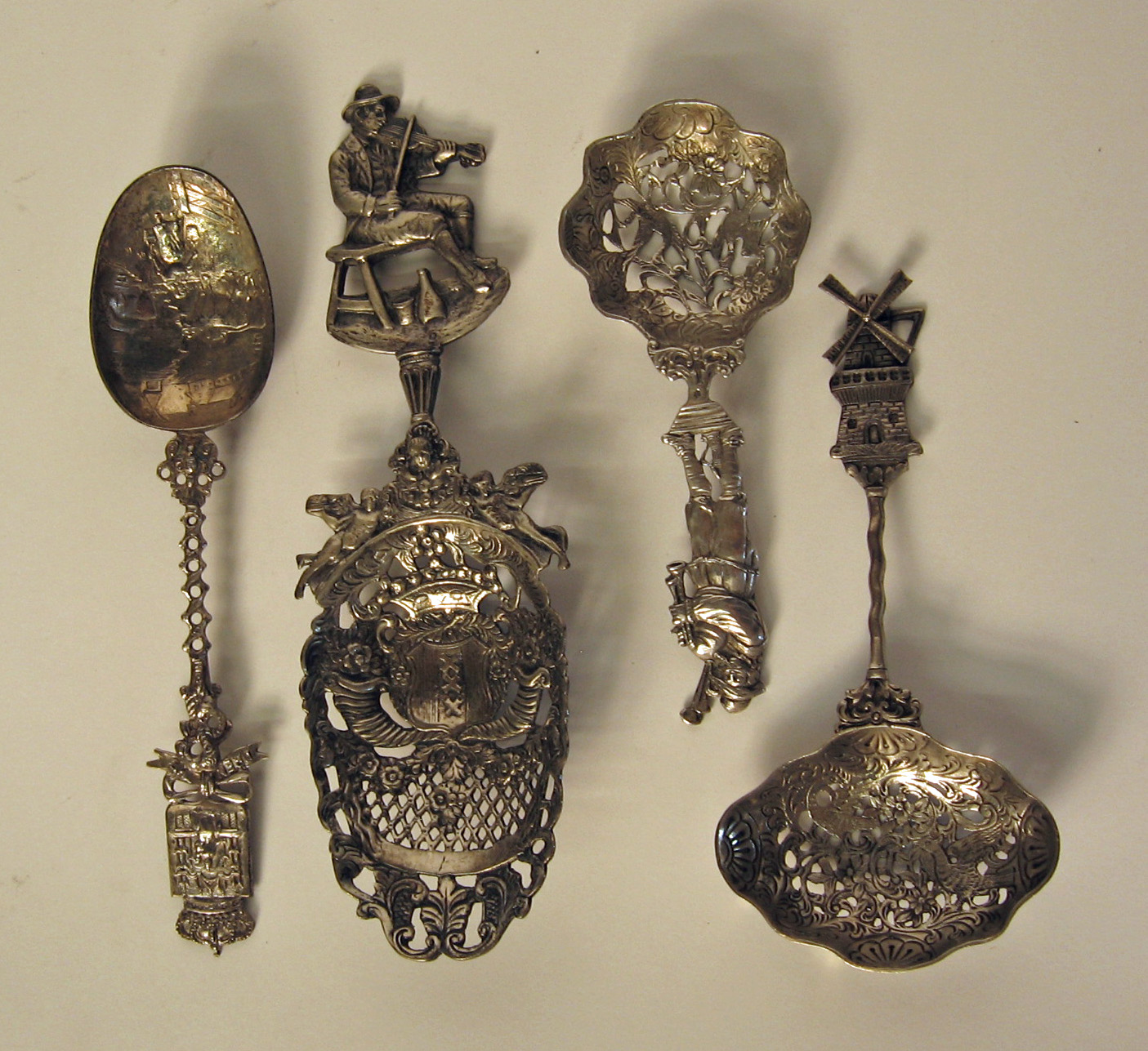 Four Continental silver novelty