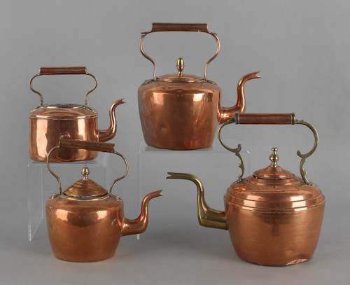 Four copper and brass kettles