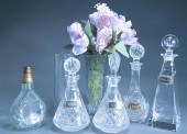 FOUR CRYSTAL DECANTERS AND A V