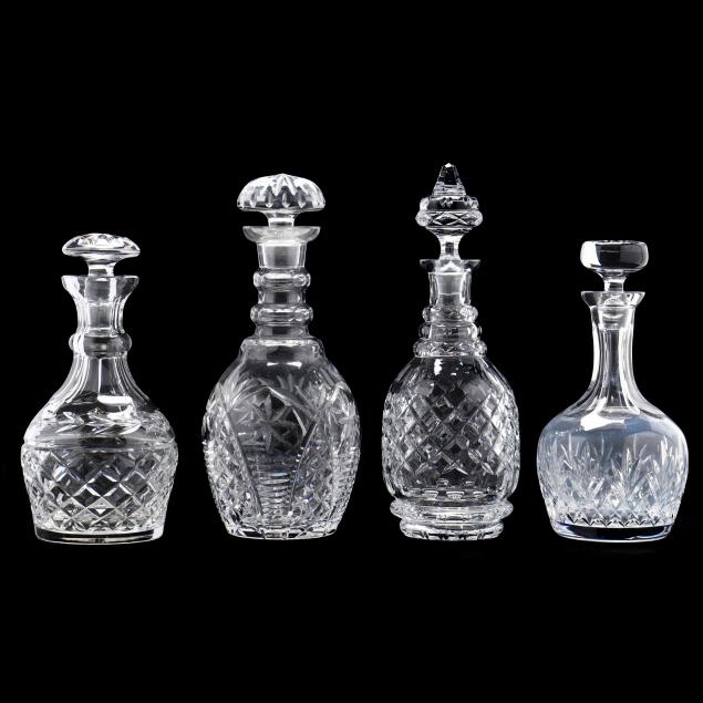 FOUR CUT CRYSTAL DECANTERS,